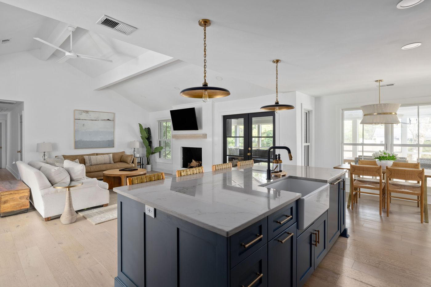 Open plan kitchen and living room with navy island