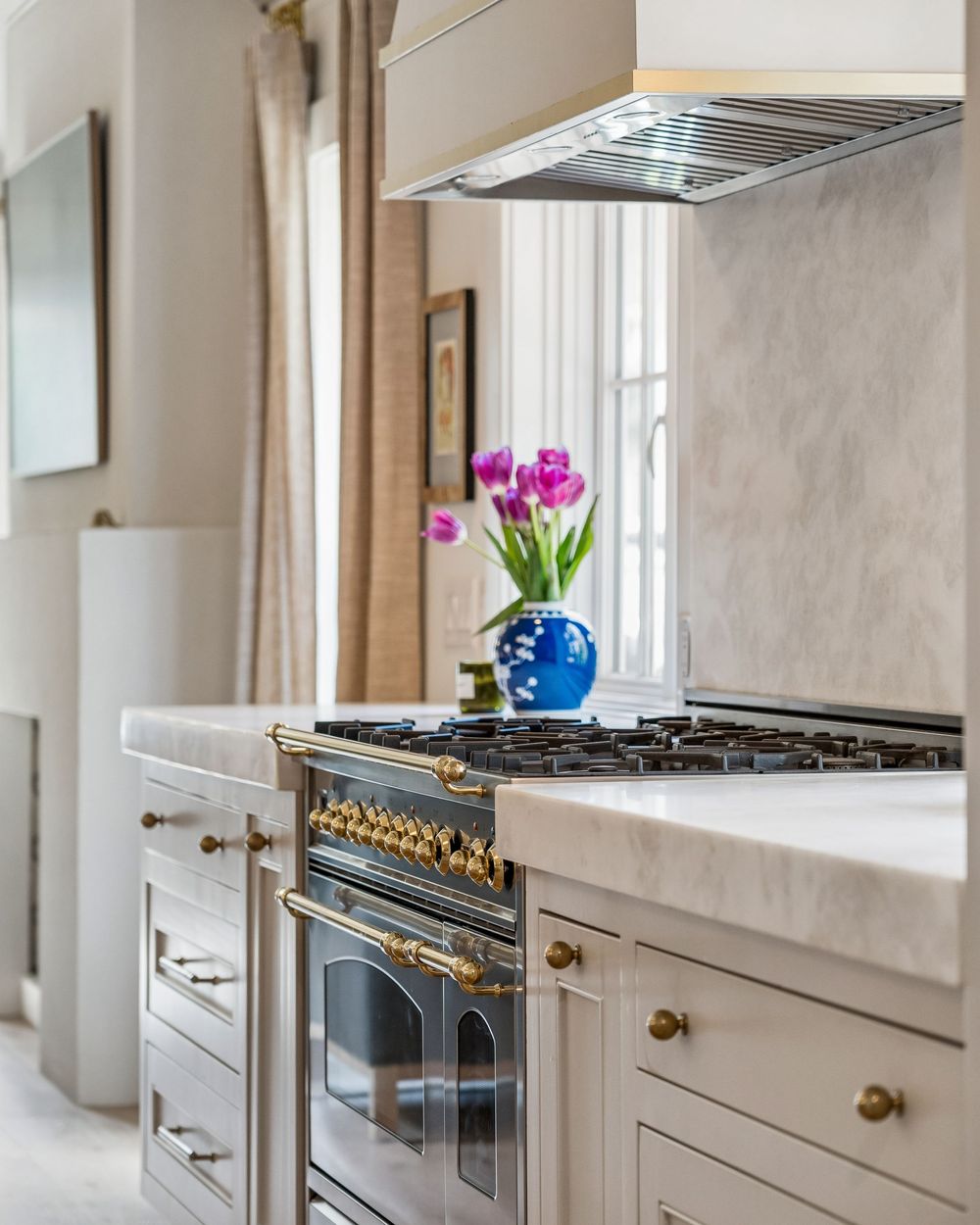 Brass and steel range with marble surround