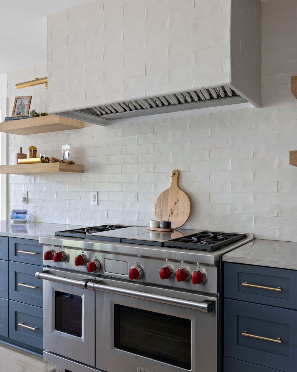 Range with tiled hood and handmade backsplash